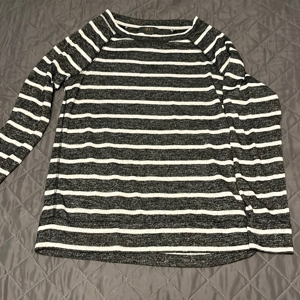 Black and white striped 3/4 length top.